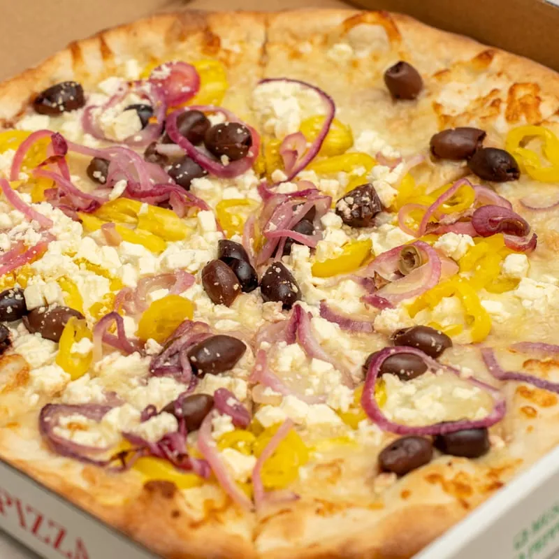 Greek pizza with Kalamata olives, banana peppers, red onions and feta