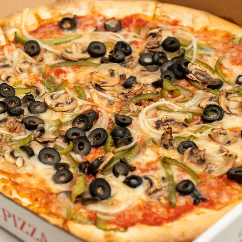 Vegetarian pizza with peppers, onions, mushrooms and black olives